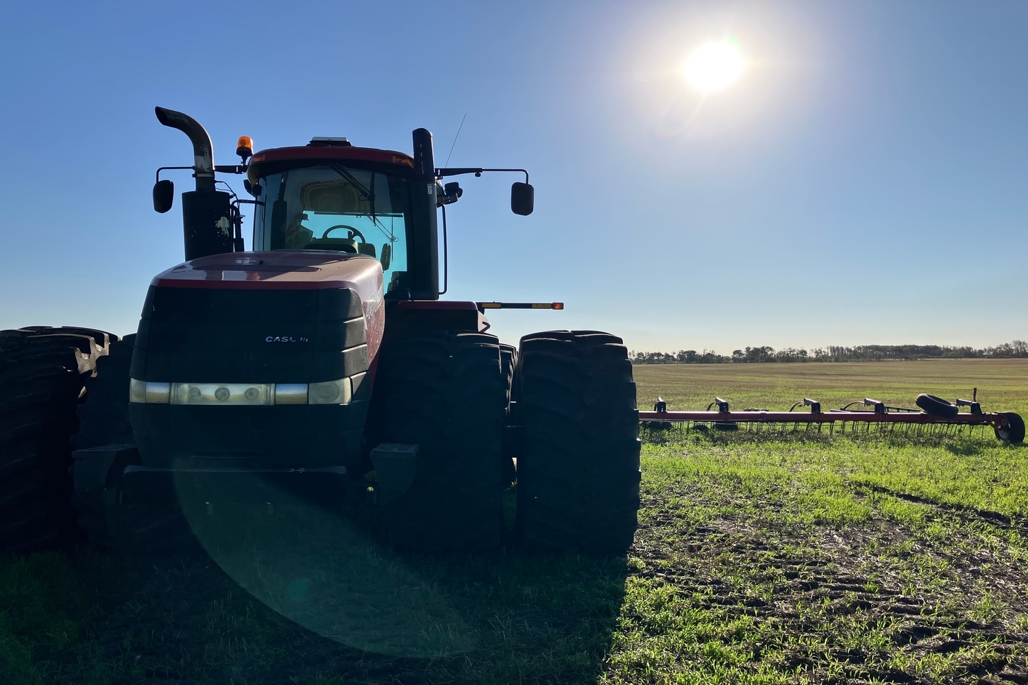 Tractor in a field near Birtle, Manitoba