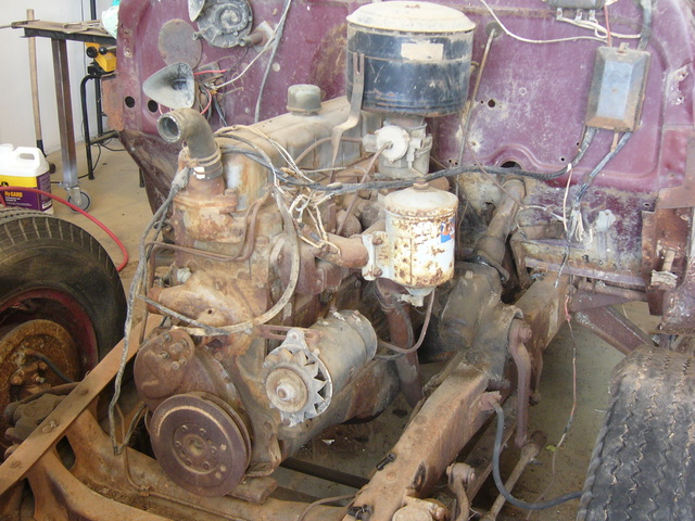 an old six-cylinder engine in a 1948 GMC pickup