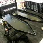Flexxifinger of Assiniboia, Saskatchewan, showed its new Corn Harvest Pans at Ag Connect Expo in Kansas City. The pans allow a regular draper header to be used for harvesting corn crops.