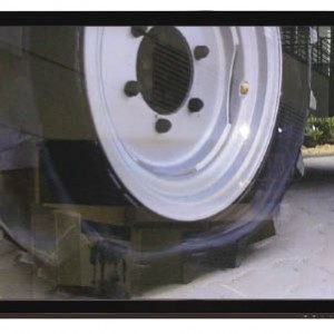 Tractor tire under heavy load.