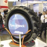 Tractor tire on display at trade show.