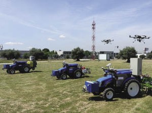 Aerial drones and driverless tractors team up to search for and destroy weeds in farm fields in the RHEA robotics prototype system.