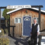 Karl Oppermann in front of the dance hall at the ranch.