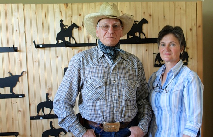 cowboy and wife in a living room