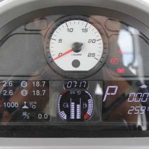 A blend of analog and digital gauges are used on the forward dash.