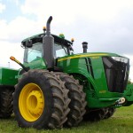 John Deere’s line of wheeled 9R tractors grows by one to a total of six for 2015, and all models get a variety of updates and an all-new options list.