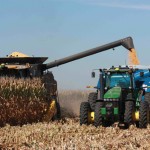 tractor and grain cart in a field