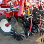 Salford’s  seeding  attachment  package  for  the  I-2100  includes  an  opener  designed  to  place  seed  just behind each coulter. 
