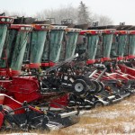 used combines on an equipment lot