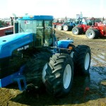 tractors in a muddy yard