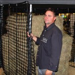 man beside hay feeder