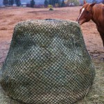 This is the larger N.A.G. bag that fits over a large round bale of hay, while smaller bags are available to hold enough hay for a day or two.