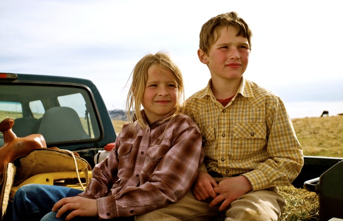 children in back of a truck