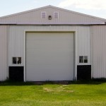 Changing the doors on a farm shop from the sliding type to a roll-up version can be a useful upgrade if you intend to heat the building in the winter.