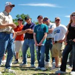 Murray Hartman, Alberta Agriculture oilseed specialist, talks to farmers at a Lethbridge field day about proper practices for producing canola.