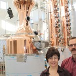 man and woman in distillery