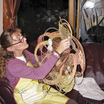 Beth Crabb working on a wall hanging.