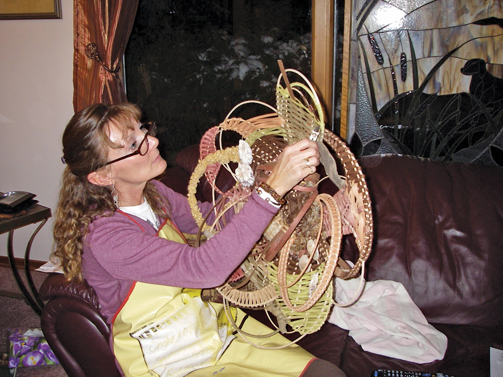 Beth Crabb working on a wall hanging.