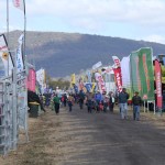 Australian farmers checking out machinery and livestock handling systems at AgQuip Field Days near Gunnedah, NSW.