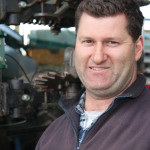 Troy Missen stands beside his single disc planter. Low soil disturbance is a key part of his ryegrass management strategy.