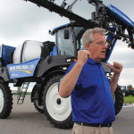 Bob Schnell discusses the benefits of front-boom sprayers at the New Holland’s head office in July.