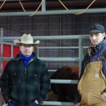 Ross Macdonald and Daniel Doerksen stop visiting long enough for a photo in the commercial cattle area.