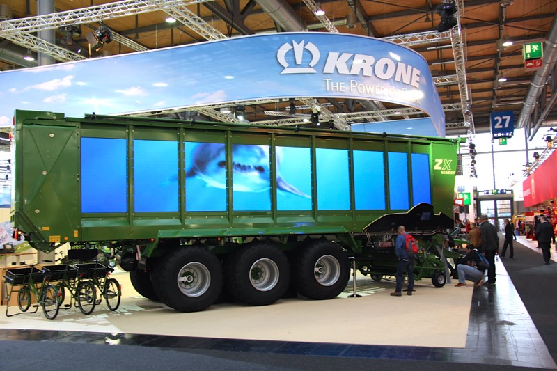 Adding bling like these synchronized television screens on the side of a Krone silage wagon help grab attention from passers-by.