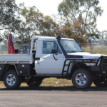 Some Utes are equipped with snorkel tubes to raise the engine intake higher, which prevent it taking in water during stream crossings and keep it up out of the dust. This one also has the more extensive front-end guard to protect the truck if it hits a kangaroo.
