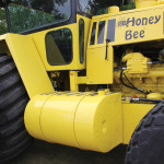 A redesigned pickup truck slip tank is used for the tractor’s fuel tank.