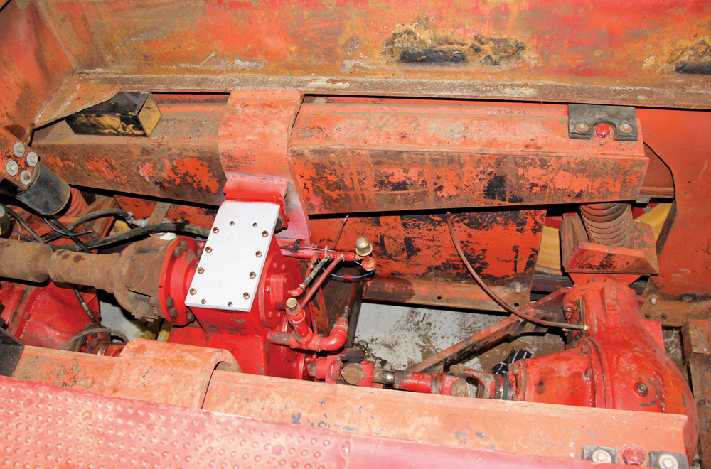The tractor rode on suspension that used a walking beam with coil springs above each axle. 
