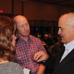 Alberta consultant, Merle Good, right, speaks with Nova Scotia farmers Wayne and Nicole Oulton in Edmonton about getting the most out of tax strategies and new approaches to farm business arrangements.