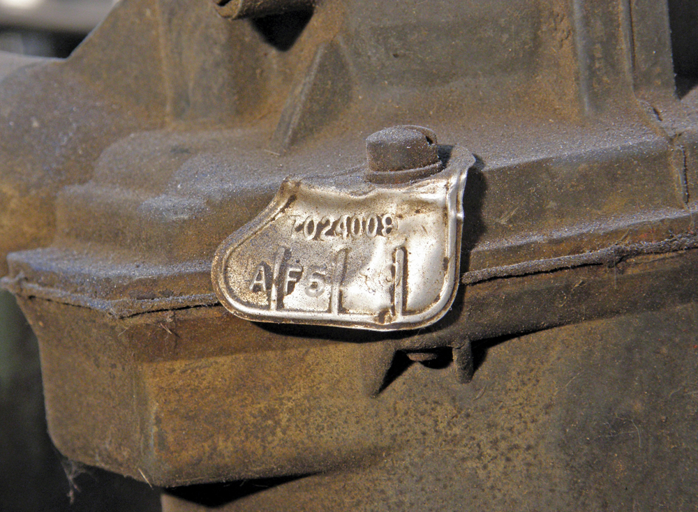 A tag like this one attached to the float bowl has a specific number identifying the model of carburetor. Use this number when purchasing a rebuild kit.