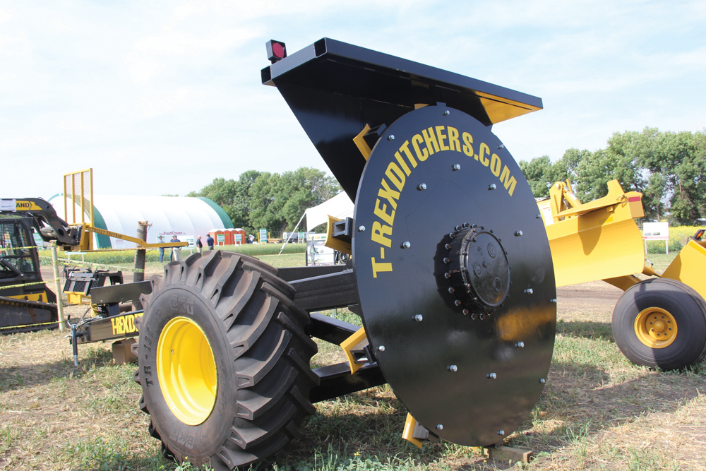 The T-Rex rotary ditcher uses an eight-foot rotary cutter to quickly create drainage runs.