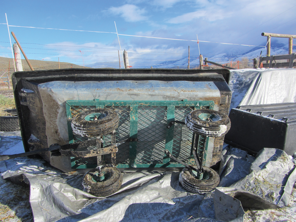 Attaching a sled to this heavy-duty cart makes it handy to haul hay to cattle regardless of the ground conditions.