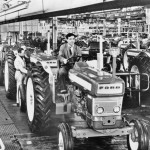 “Pre Force” Ford tractors move down the line in what is now New Holland’s Basildon England assembly plant. 