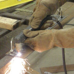 A framing square was used as a guide for the plasma torch to ensure a perfectly straight edge.