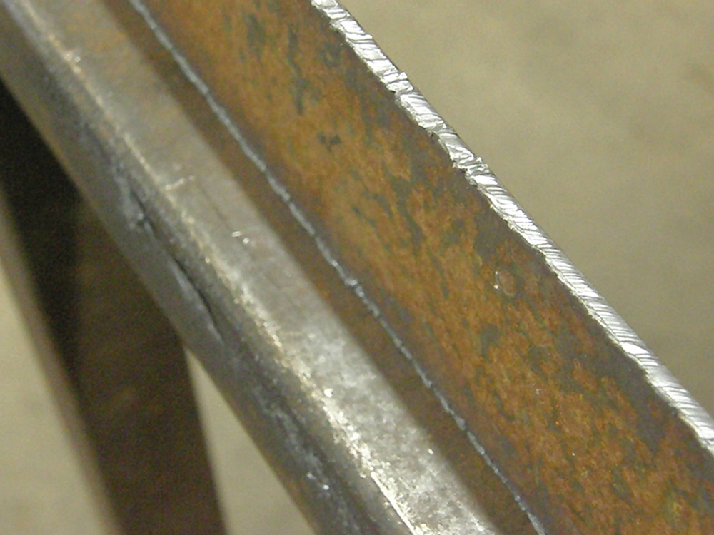 The plasma cutter leaves a striated edge on the steel similar to that of an acetylene torch. It requires some dressing with a grinder to create a finished face.