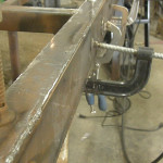 Welding was spread out along the length
of the joint to prevent concentrating heat into one area and warping the metal.