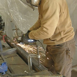 An angle grinder is used to smoothen out the weld bead and make the bumper look like one seamless piece.