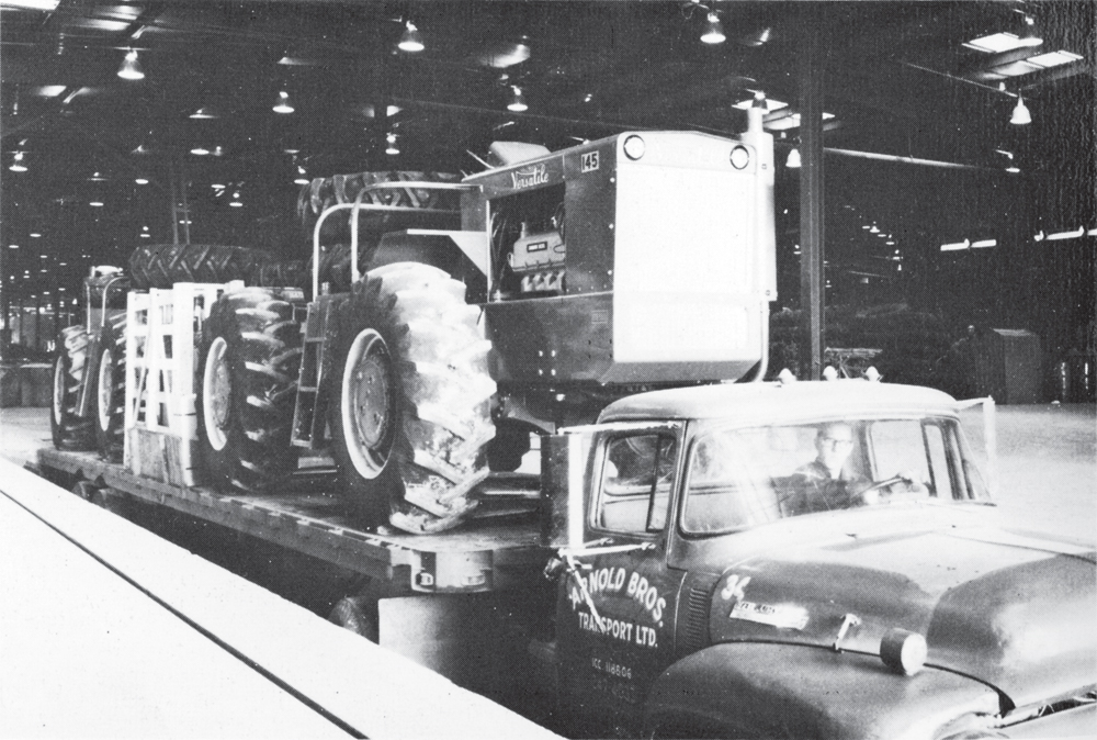 Leaving the factory a few years after tractor production began, this truck is loaded with model 145 Versatile tractors.