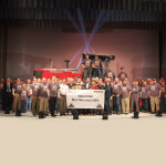 Unveiled to a group of visitors and its purchaser during a special ceremony, the 100,000th swather to be built at AGCO’s Hesston, Kansas, manufacturing facility was centre stage at the facility’s auditorium.
