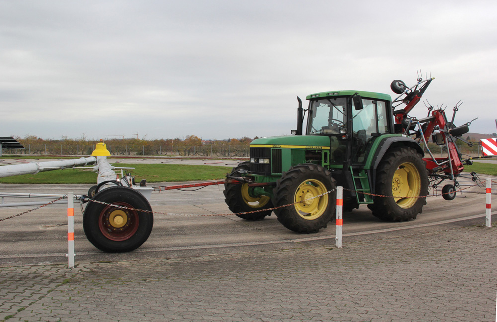 A rotating arm pulls tractors and equipment around a bump track at the DLG test facility in Gross Umstadt Germany.