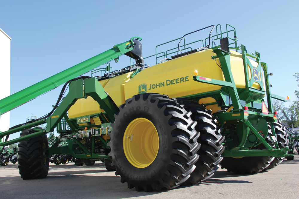 The C850 drill has three main product tanks and a 50 bushel small product tank on mounted on load cells.
