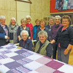 Some of the Herschel Quilting and Recycling Group. Back row (l to r): Sue Neufeld, Sharon Wiens, Virginia Wilson. Middle row (l to r): Lynn Hollick, Emily Brown, Sylvia Cutler, Cheralyn Wiens, Marlene Wiens, Dorothy Seibold. Front row (l to r): Margery Martin, Kay Heatherington.