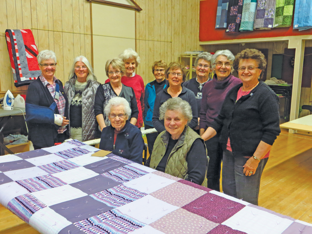Some of the Herschel Quilting and Recycling Group. Back row (l to r): Sue Neufeld, Sharon Wiens, Virginia Wilson. Middle row (l to r): Lynn Hollick, Emily Brown, Sylvia Cutler, Cheralyn Wiens, Marlene Wiens, Dorothy Seibold. Front row (l to r): Margery Martin, Kay Heatherington. 