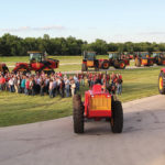 Customers (posing here for a group photo) who purchased one of the Legendary Limited Edition models were presented with the keys to their new tractors just before Big Roy made his appearance.