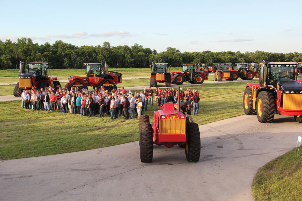 Customers (posing here for a group photo) who purchased one of the Legendary Limited Edition models were presented with the keys to their new tractors just before Big Roy made his appearance.