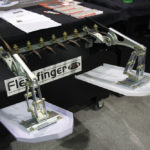 Flexxifinger's header attachment is designed to hold down soybean rows while winter wheat is harvested in the same field, without damaging the bean crop.