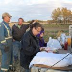 Supper in the field at the Millard farm, near Livelong, Sask. Pictured are Leo Millard, Myron Lipteck, Wanda Millard, and Julianna Millard.