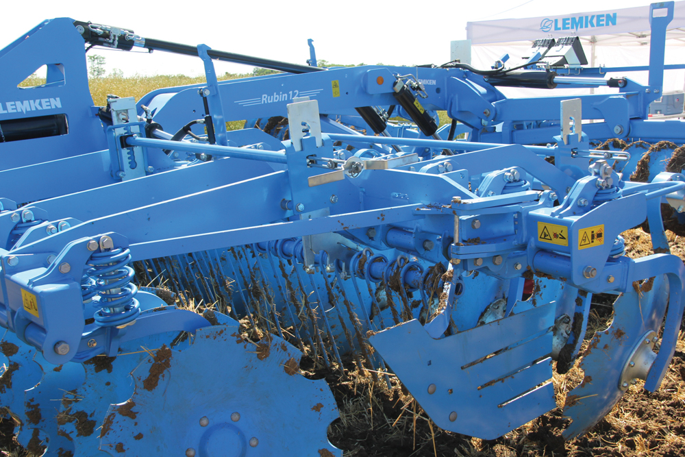 Harrow tines between the disc rows help break up and mix surface material.